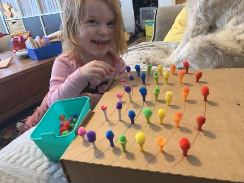 Hammer in the golf tees, and then challenge your kids to balance the pom poms on top! Making rainbows, or just matching colors, either way your little ones will have a blast!