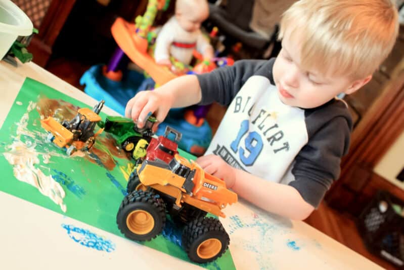 painting with lots of trucks and vehicles makes it fun for toddlers to get creative