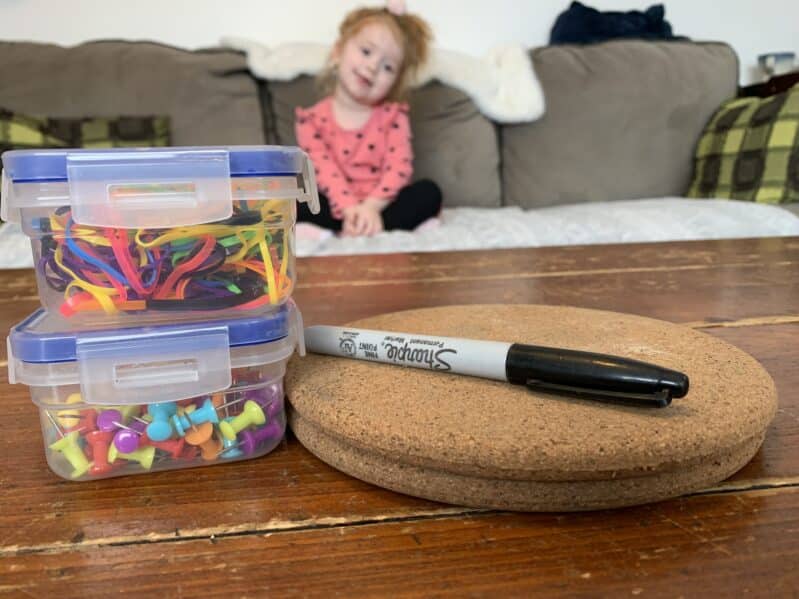 Supplies needed to make a cork based homemade geoboard for toddlers