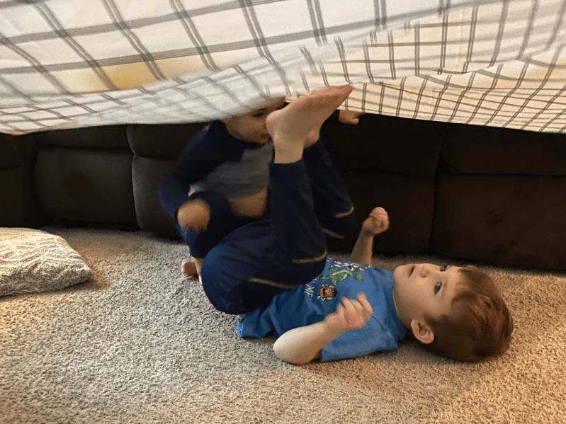 Use blanket games to build gross motor skills in young children such as rolling, walking, running, crawling, pulling, kicking, and throwing.