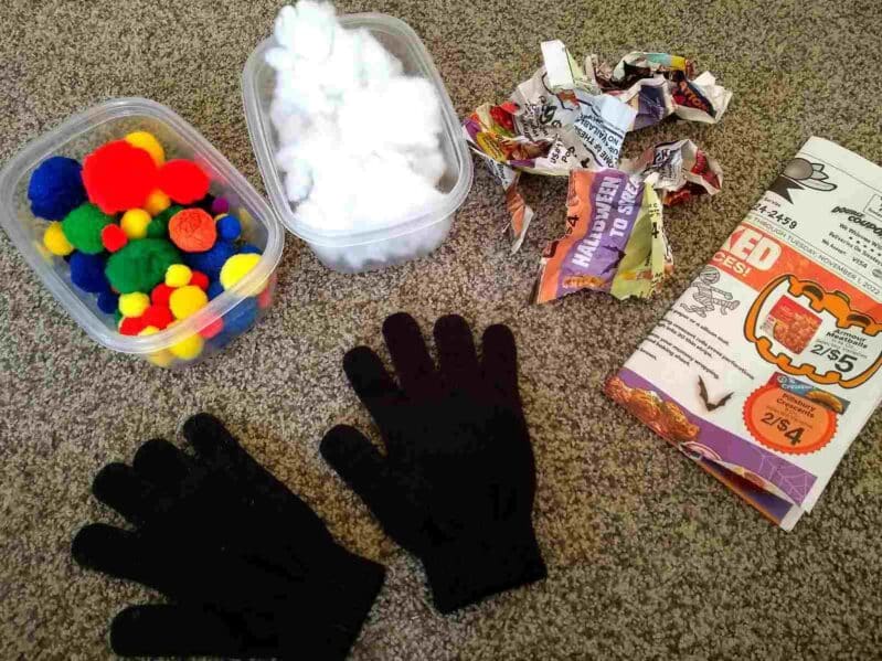 Pom poms, cotton balls, or newspaper make great fillers when stuffing old gloves for some fine motor fun in this super simple activity for toddlers and preschoolers to enjoy learning at home.