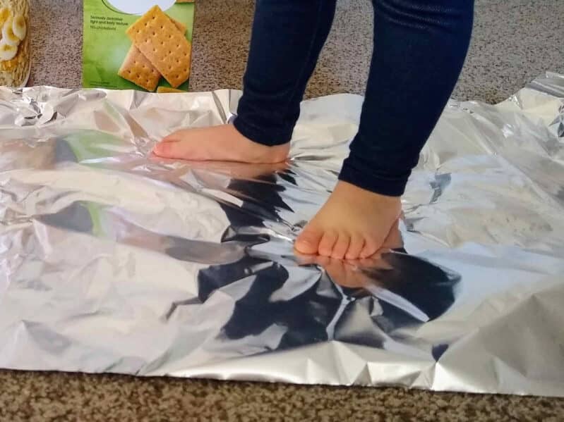 Stop around on tinfoil for toddler sensory fun at home!