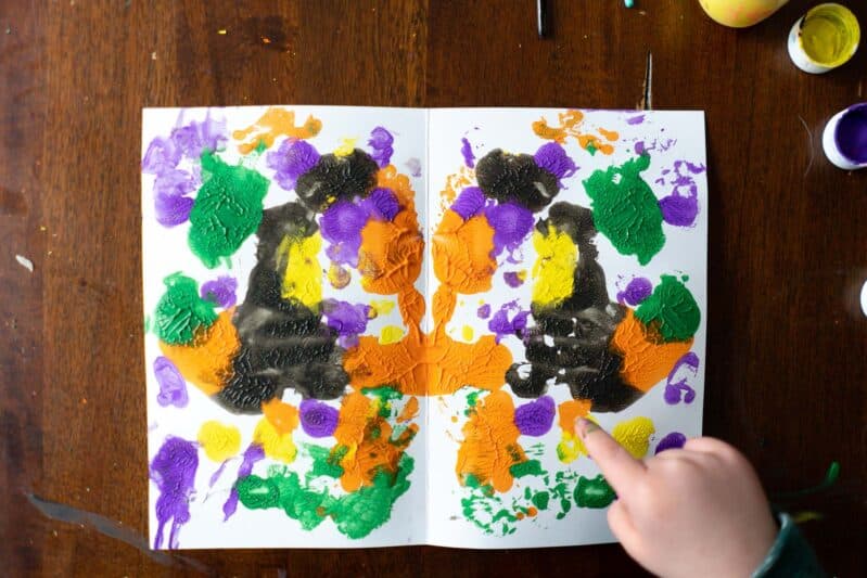 Make an adorable and beautiful butterfly using symmetrical blot painting technique with preschoolers at home on card stock and add a little pipe cleaner antenna for fun!