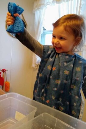Clara wrings out her sponge
