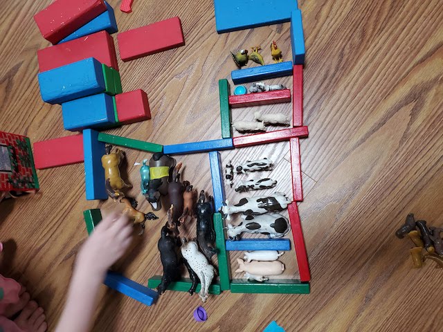 Build a zoo with the kids to teach critical thinking and grouping skills by sorting animals into categories in this simple preschooler activity using supplies you already have.