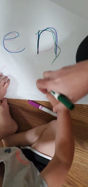 Name tracing practice with different colored markers
