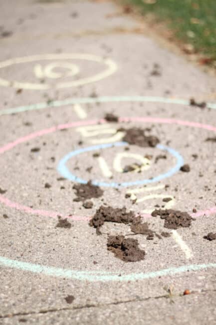 Set up a target and have kids throw some mud and play! And easy DIY target practice for preschoolers. Don't be afraid to let them get messy!