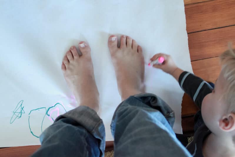 Tracing feet to compare the size