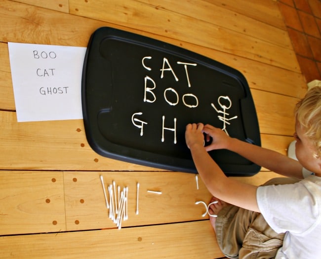 Building and making words with a Halloween alphabet using Q-tips