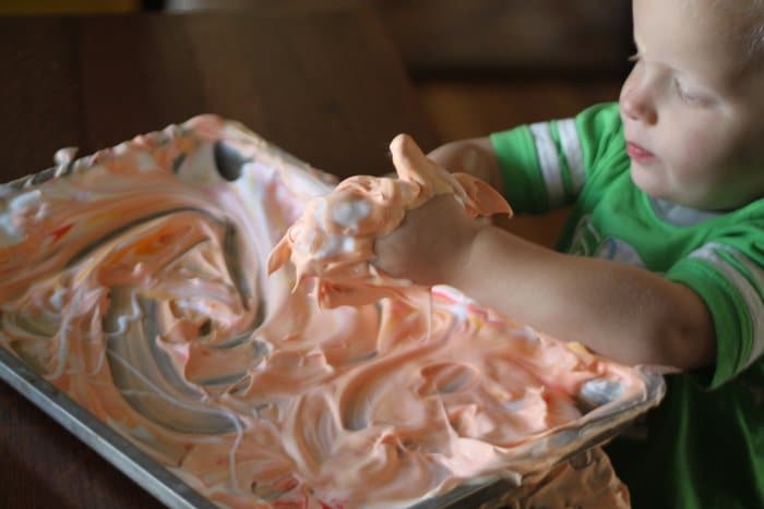 Add some food coloring to shaving cream for a fun sensory activity!