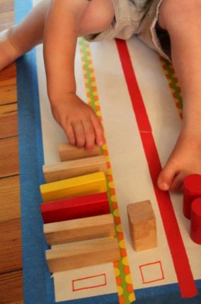 Wooden blocks arranged in colored columns to form a bar graph