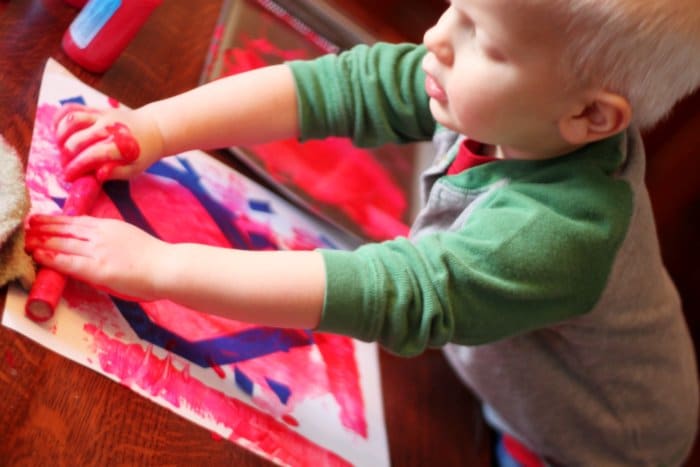 Rolling in the Paint to Make Valentine Art for Toddlers