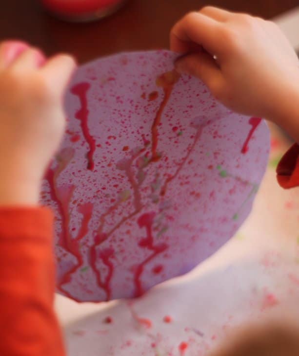 Try painting with toothbrushes and plain old gravity for a creative art activity!