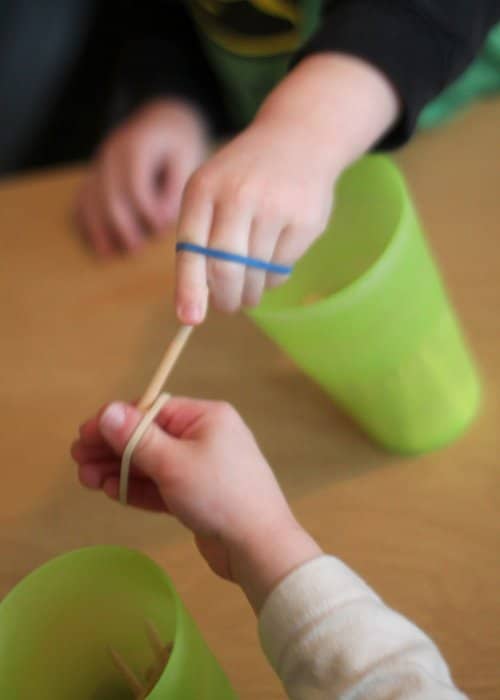 A fine motor activity that focuses on hand strength using rubber bands.