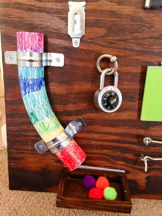 Colored PVC pipe and padlocks for toddler busy board