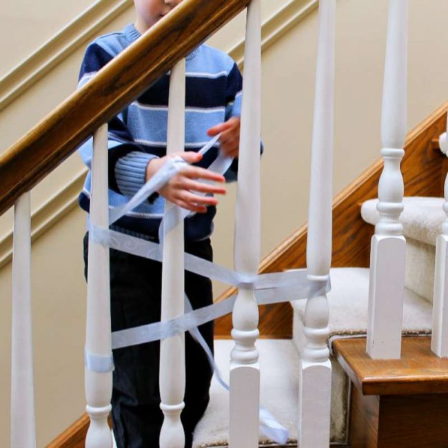 learn all about weaving for kids by introducing it on staircase spindles