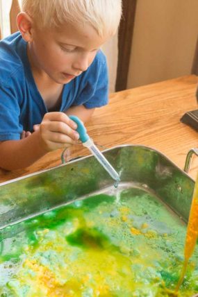 Using colored vinegar to see eruptions in baking soda (and mixing colors!)