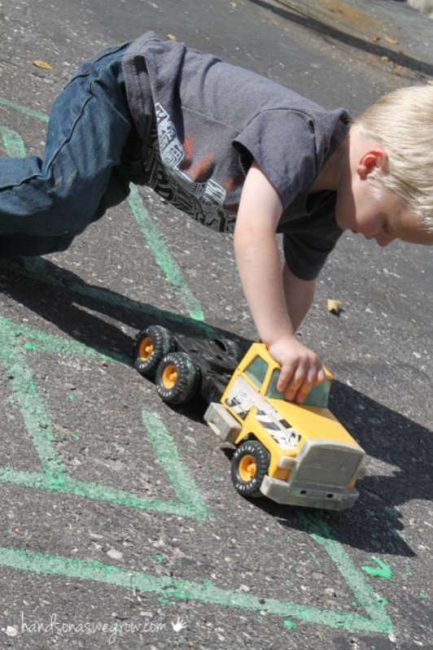 Your preschooler will love to drive cars and trucks around their big chalk maze!