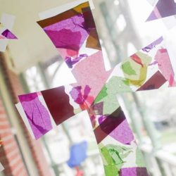 A beautiful and simple cross Easter craft for kids (especially toddlers) to make for a Christian art project with contact paper that has a stained glass cross effect! So pretty!