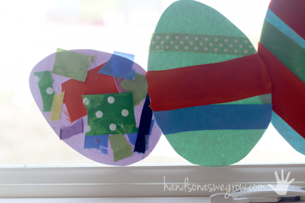 Most of the Easter egg craft hanging in the window