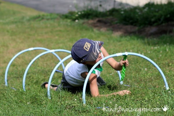 Make a tunnel and capture flag in an obstacle course for kids in your own backyard.