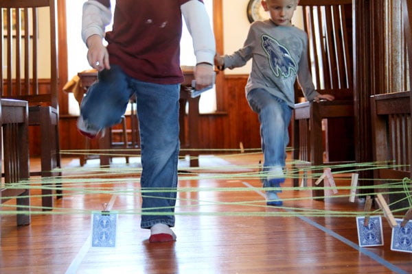 A string obstacle course to get kids moving and learning about numbers (number bonds to 10 and matching numbers)