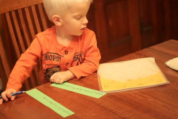 Finding all the letters in the I Spy Sensory Bag by tipping the contents