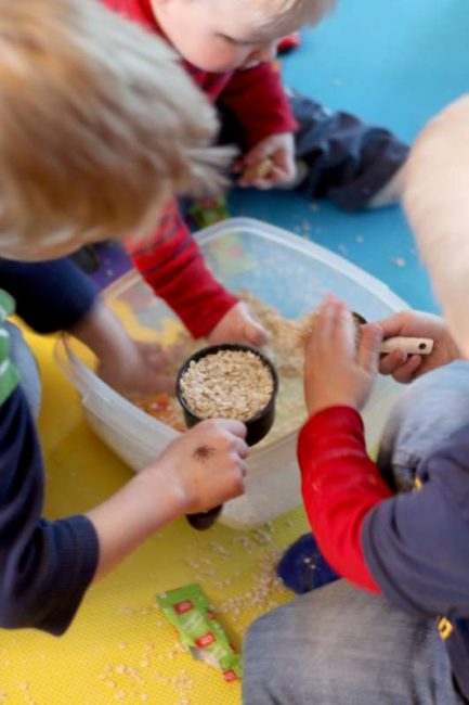 Add scoops (measuring cups) to play in an indoor sandbox