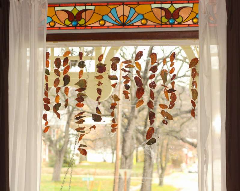 Decorate the window for fall with leaf garlands