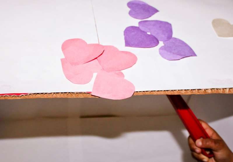 Toddlers and preschoolers will love playing with this super simple DIY hearts theme magnet table for all kinds of learning activities using household supplies.