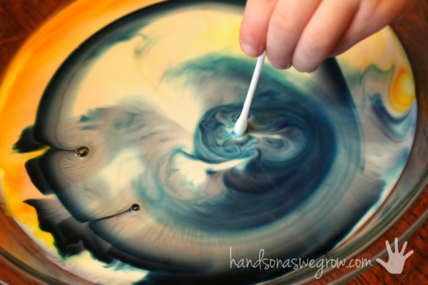 Mixing green with the color changing milk experiment!