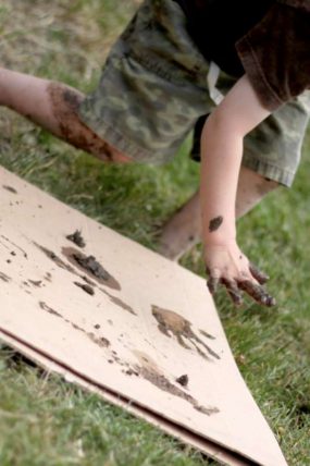 Playing in the mud making prints