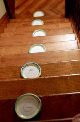 Put their name on the stairs for a pom pom learning game
