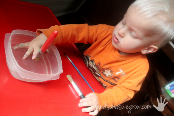 Painting with water is an easy starter painting activity, great for toddlers