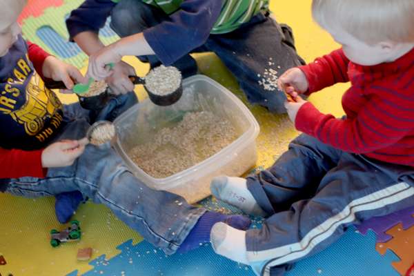 Kids playing in their indoor sandbox