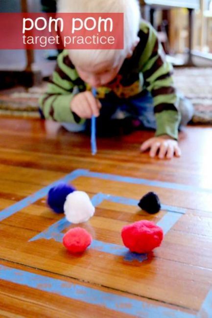 Pom pom target practice for preschoolers -- by blowing!