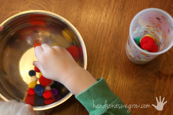 Transfer pom poms to strengthen hand strength and coordination