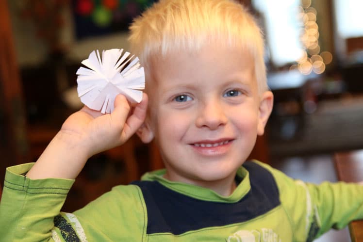 Make snowflakes at Grandma's! One of the simple holiday activities to do with Grandma!