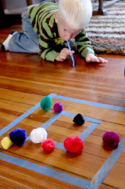 Easy target practice for preschoolers using pom poms