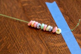 Thread a Fruit Loop Necklace - Hands On As We Grow®