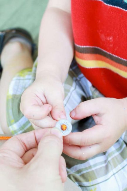 Thread washers onto yarn to add a little jingle to your wind chimes!