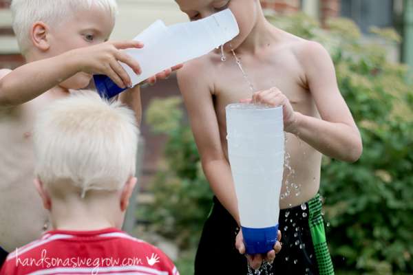 Make a water scoop to fill up a funnel made from bottles