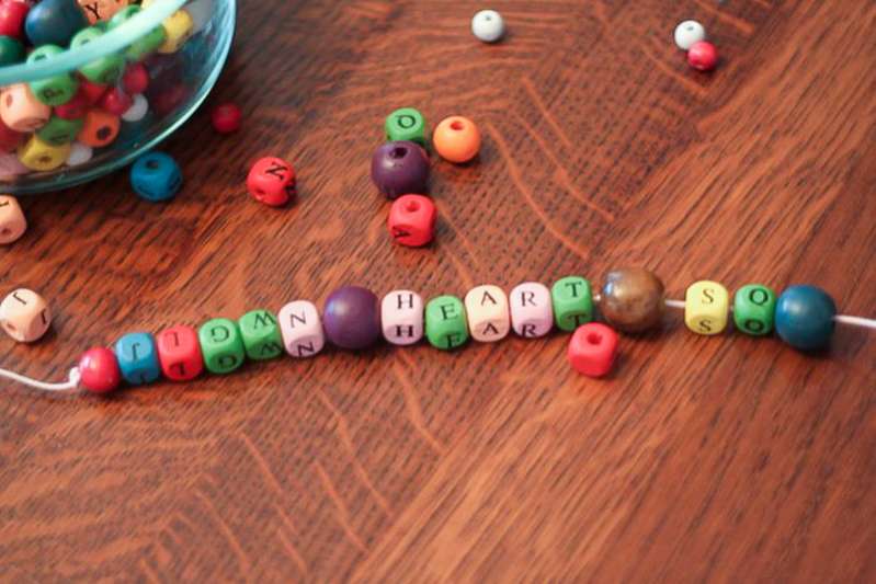 Write spelling words with beads - one of 21 ways to practice spelling words!